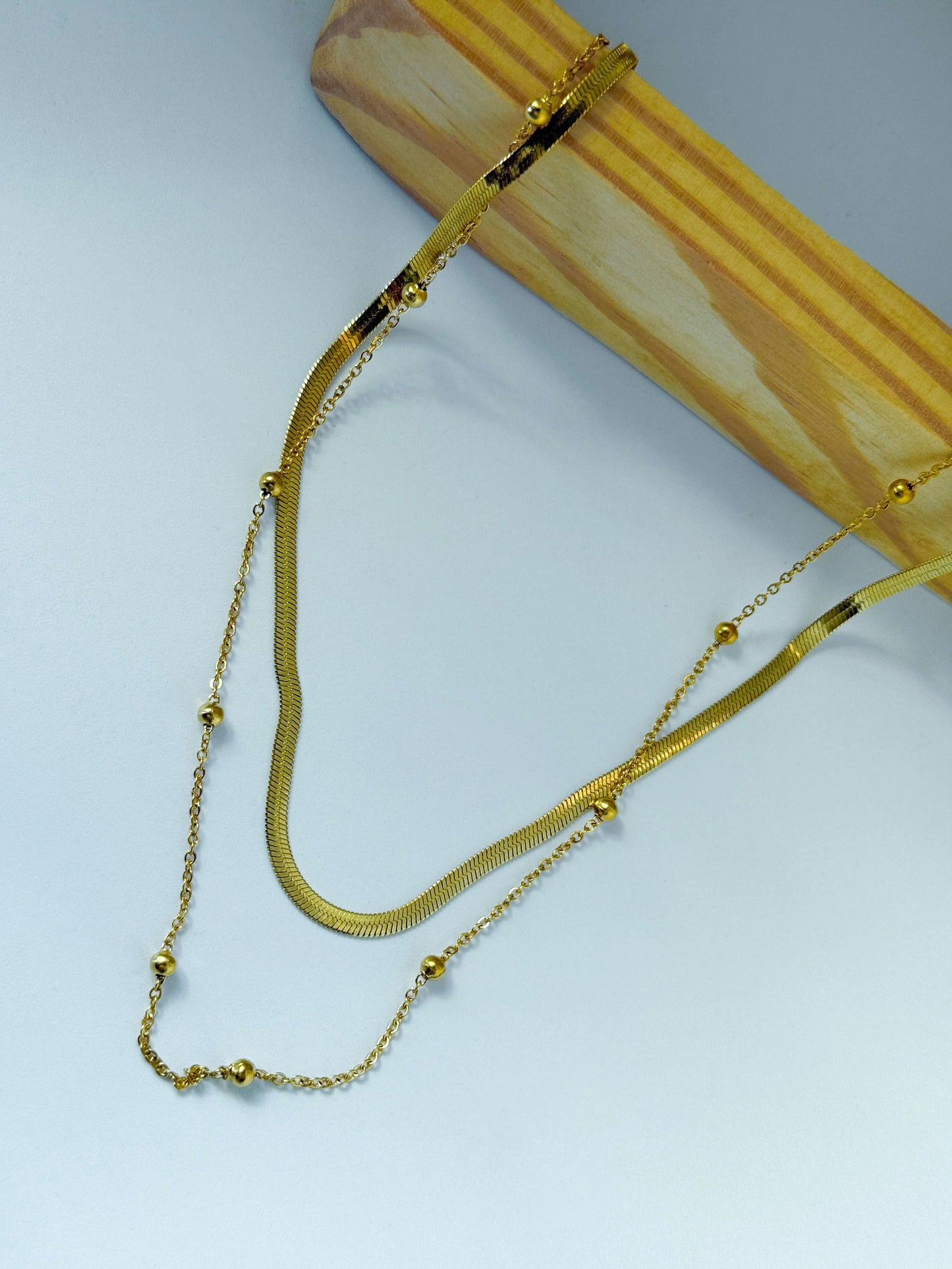 Anti tarnish Radiant Gold necklace on a light gray background