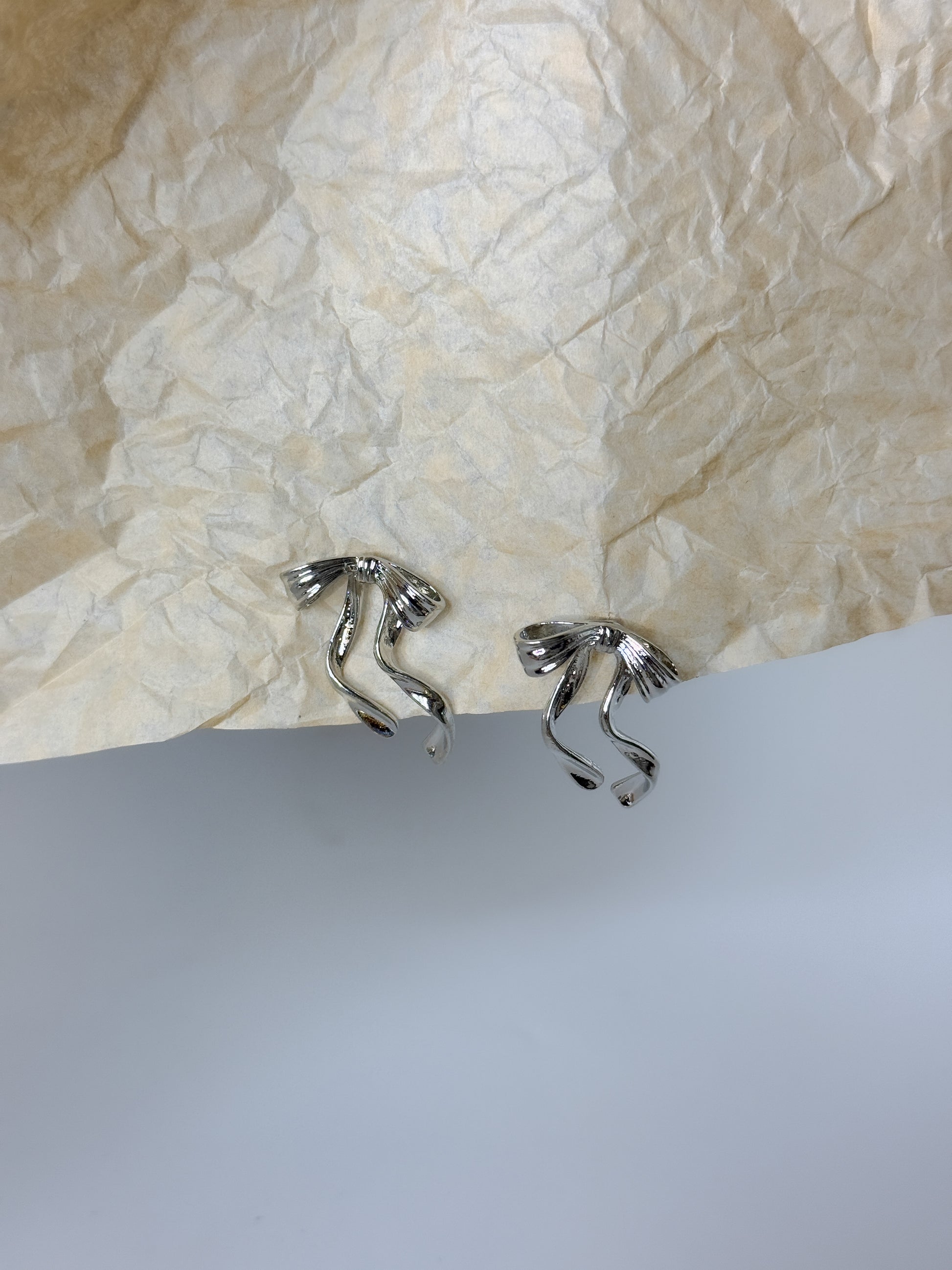 Simple silver bow-shaped earrings, modern minimal jewelry