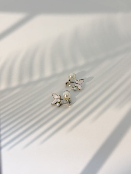 Pair of silver butterfly earrings with pearl accents for a daily wear