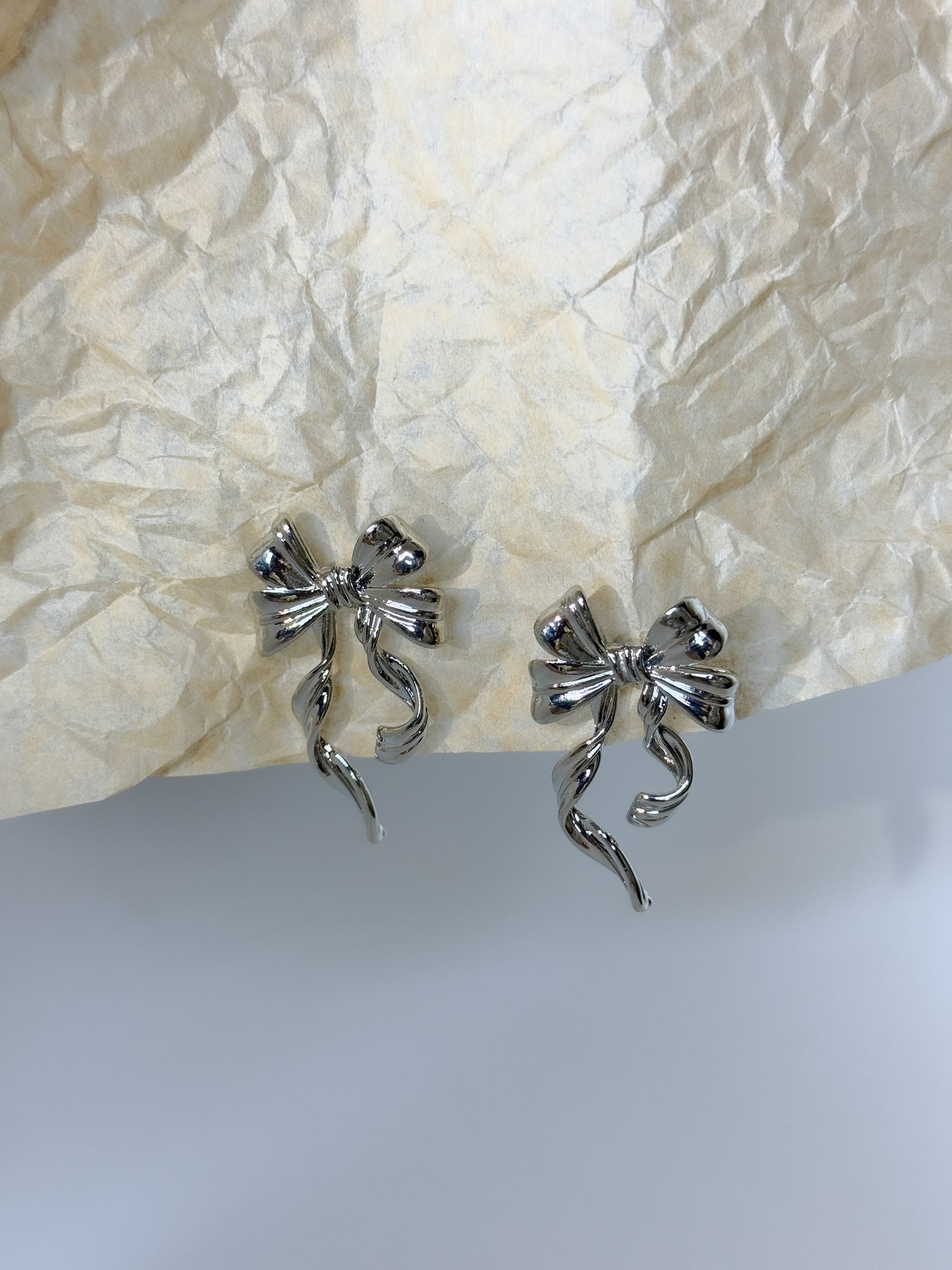 Simple silver bow-shaped earrings, modern minimal jewelry