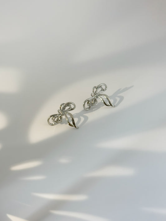 Dainty bow-shaped sterling silver stud earrings