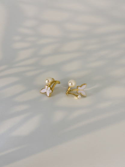 modest golden dainty earrings with a pair of pearls touch