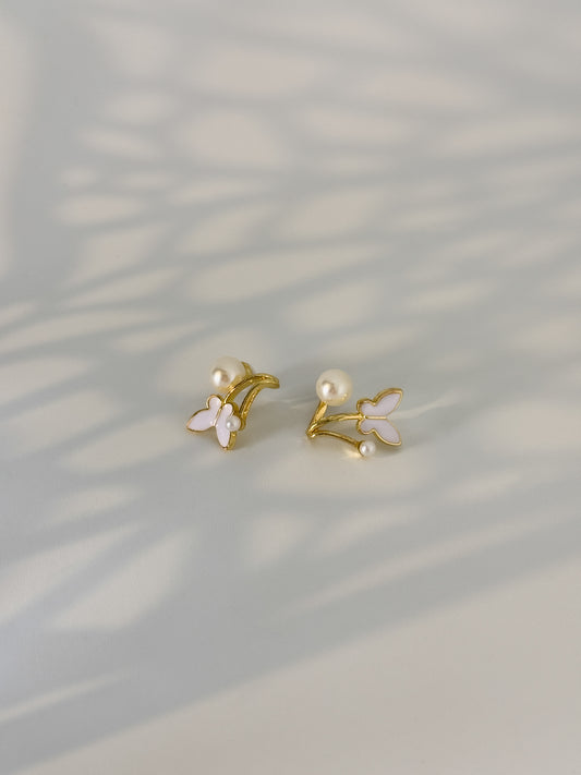 modest golden dainty earrings with a pair of pearls touch