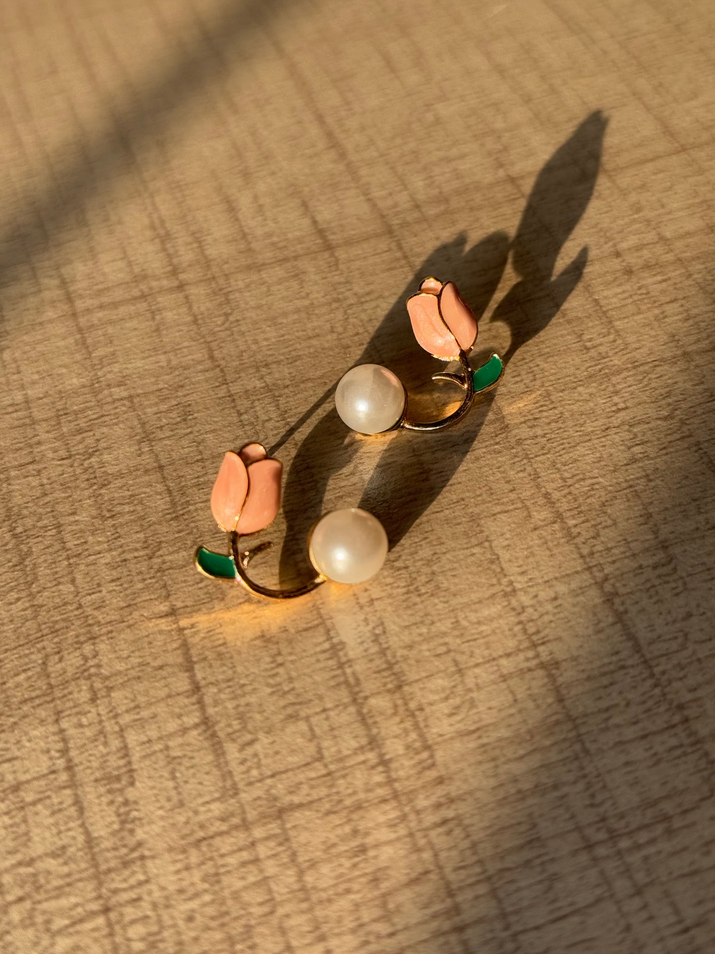 sunset look of a peach bud in golden metal