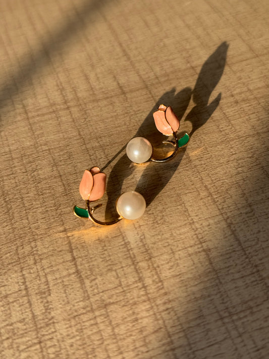 sunset look of a peach bud in golden metal