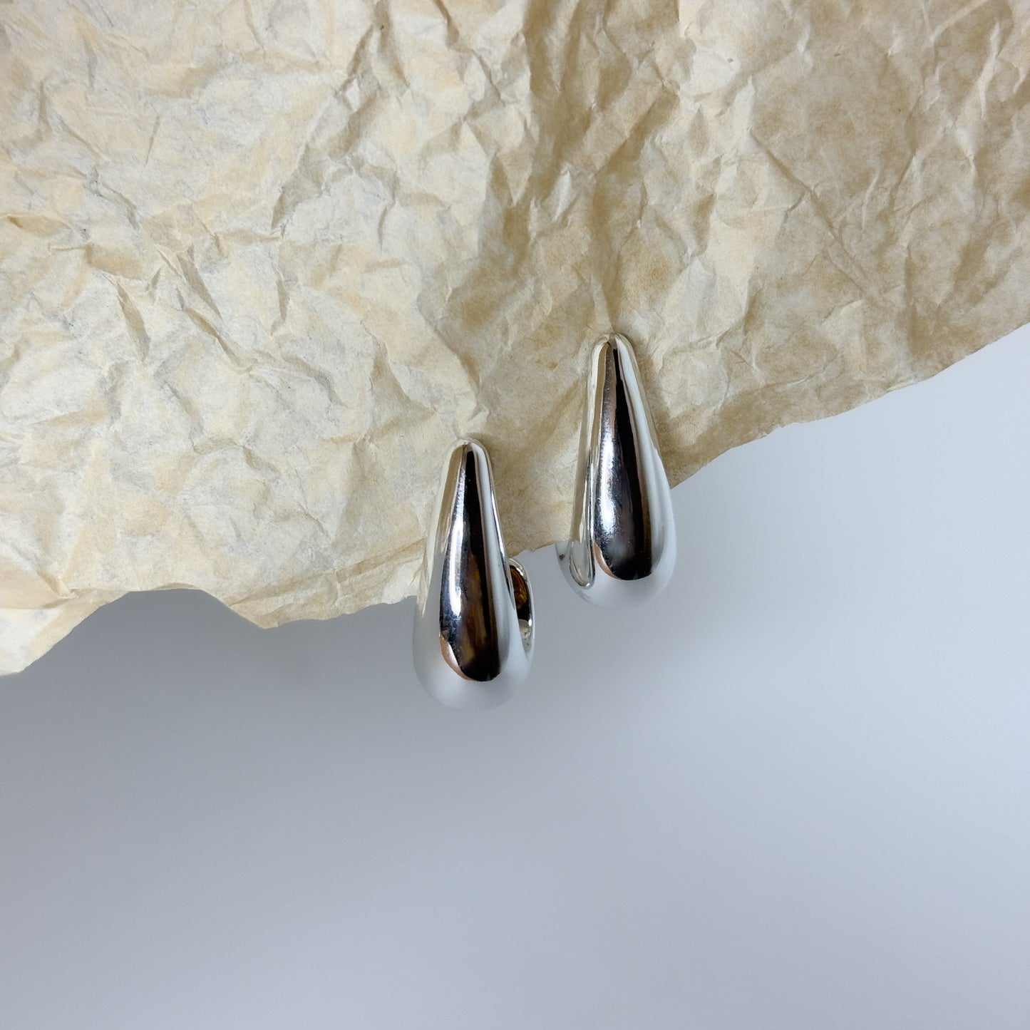Sleek minimal silver teardrop earrings, chic style