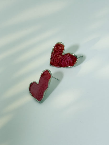 Modern fashion portrait featuring minimal maroon earrings