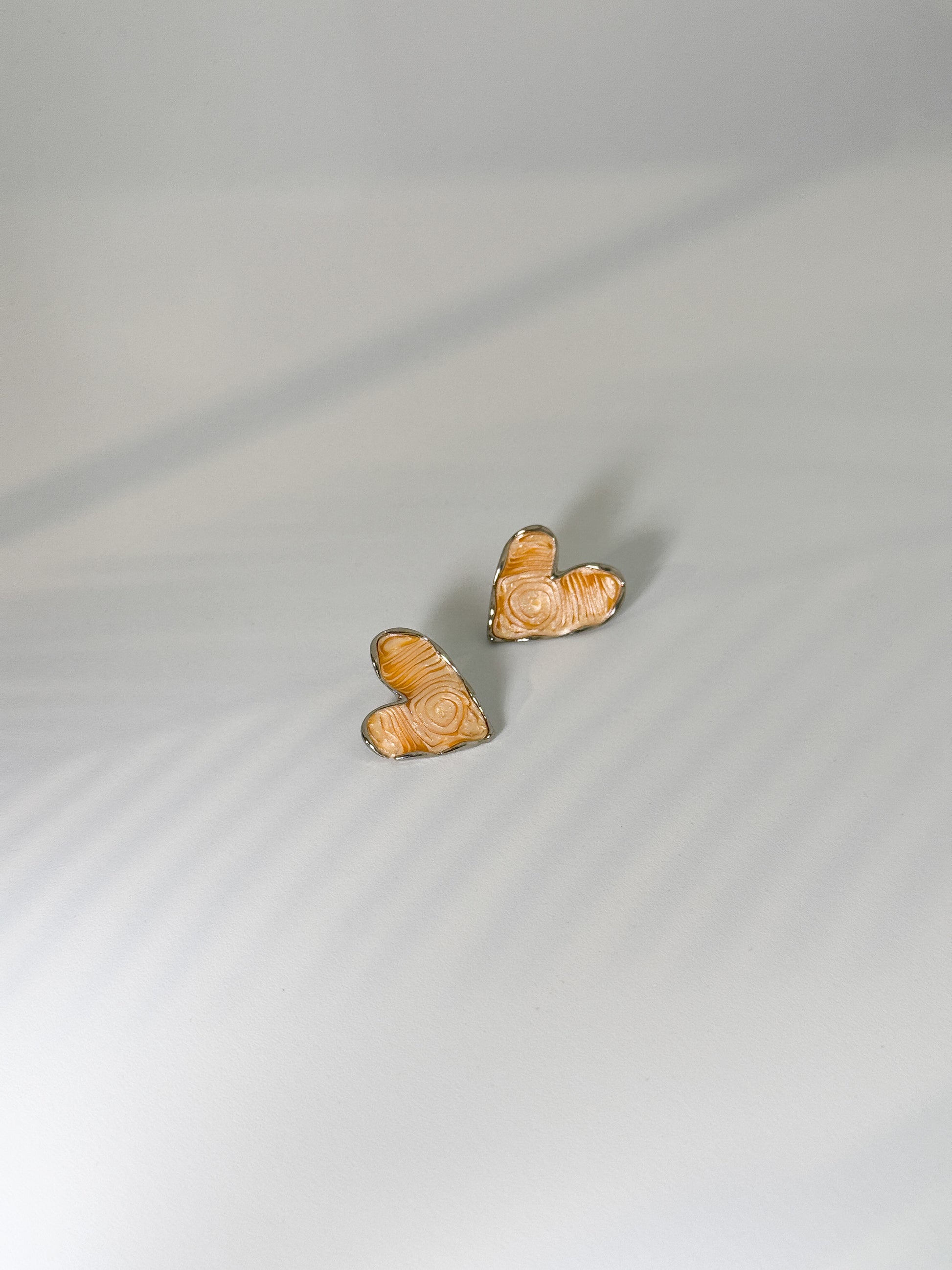 Minimal beige stud earrings for everyday wear