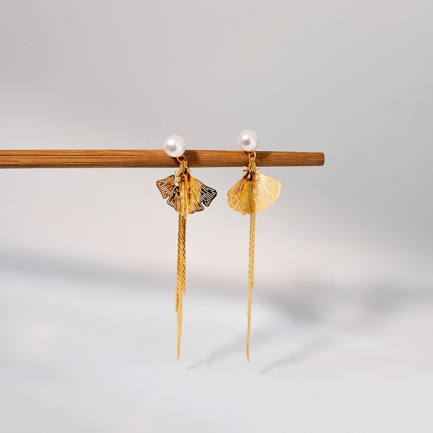 Golden Bold party wear earrings with textured design in pearl look