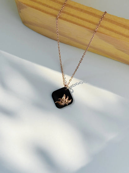 Anti Tarnish Necklace with a black pendant featuring a gold design on a light background | Minukki